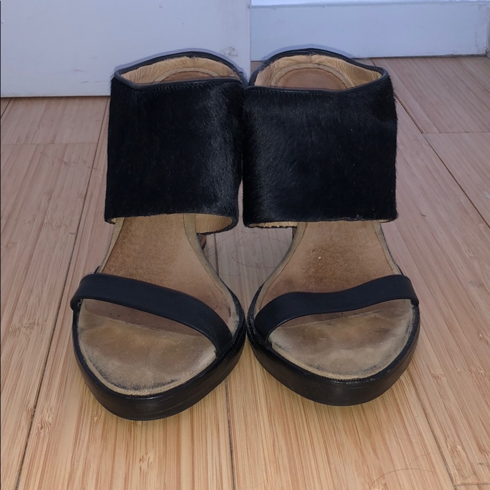 Black platform open toe heels with hair calf strap